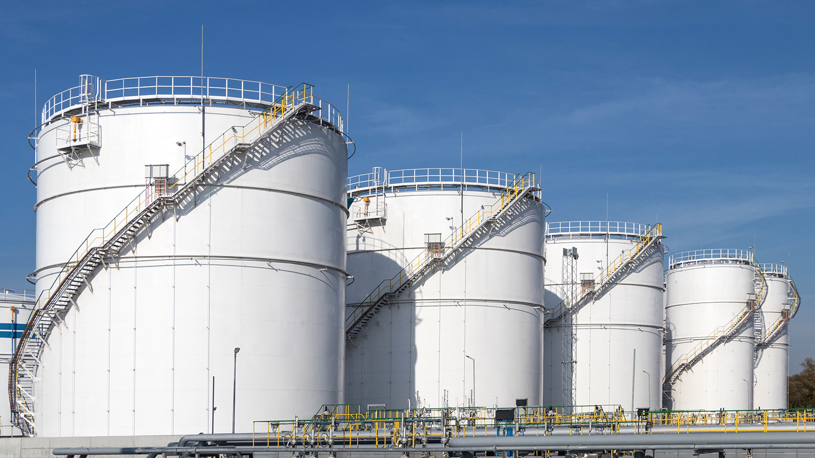 Oil storage tanks and pipes at the oil terminal Oil storage tanks and pipes at the oil terminal
