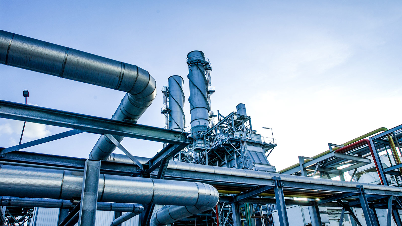 Petrochemical processing facility with industrial piping, process towers, and API-standard equipment for hydrocarbon processing. Petrochemical processing facility with industrial piping, process towers, and API-standard equipment for hydrocarbon processing.