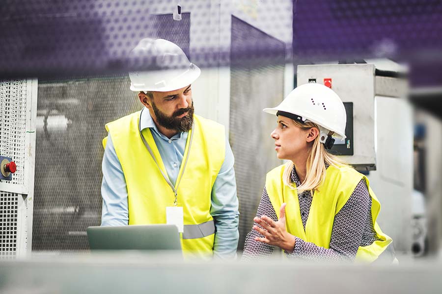 Engineers working together in factory